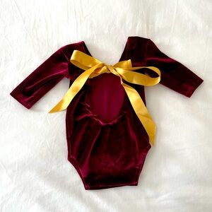 NEWBORN velvet bodysuit in wine red color with golden yellow bow.
